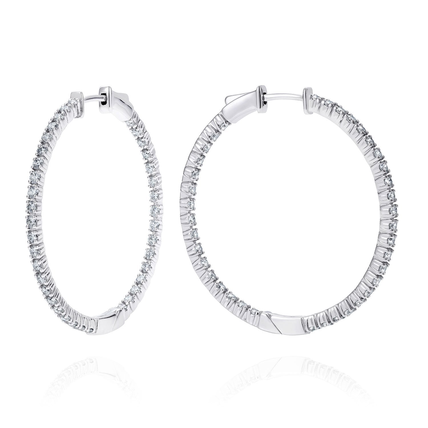 Devi Jewels embraces history with modernity. This piece in particular blends the past and present in a beautiful play of dazzling diamonds lining both inside and outside of the hoop. They are breathtaking from every angle elevating a feminine look with pure radiance.